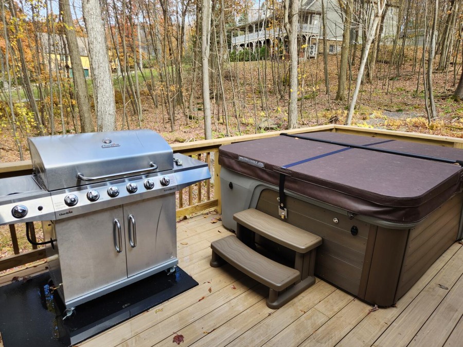 Back deck with hot tub and grill